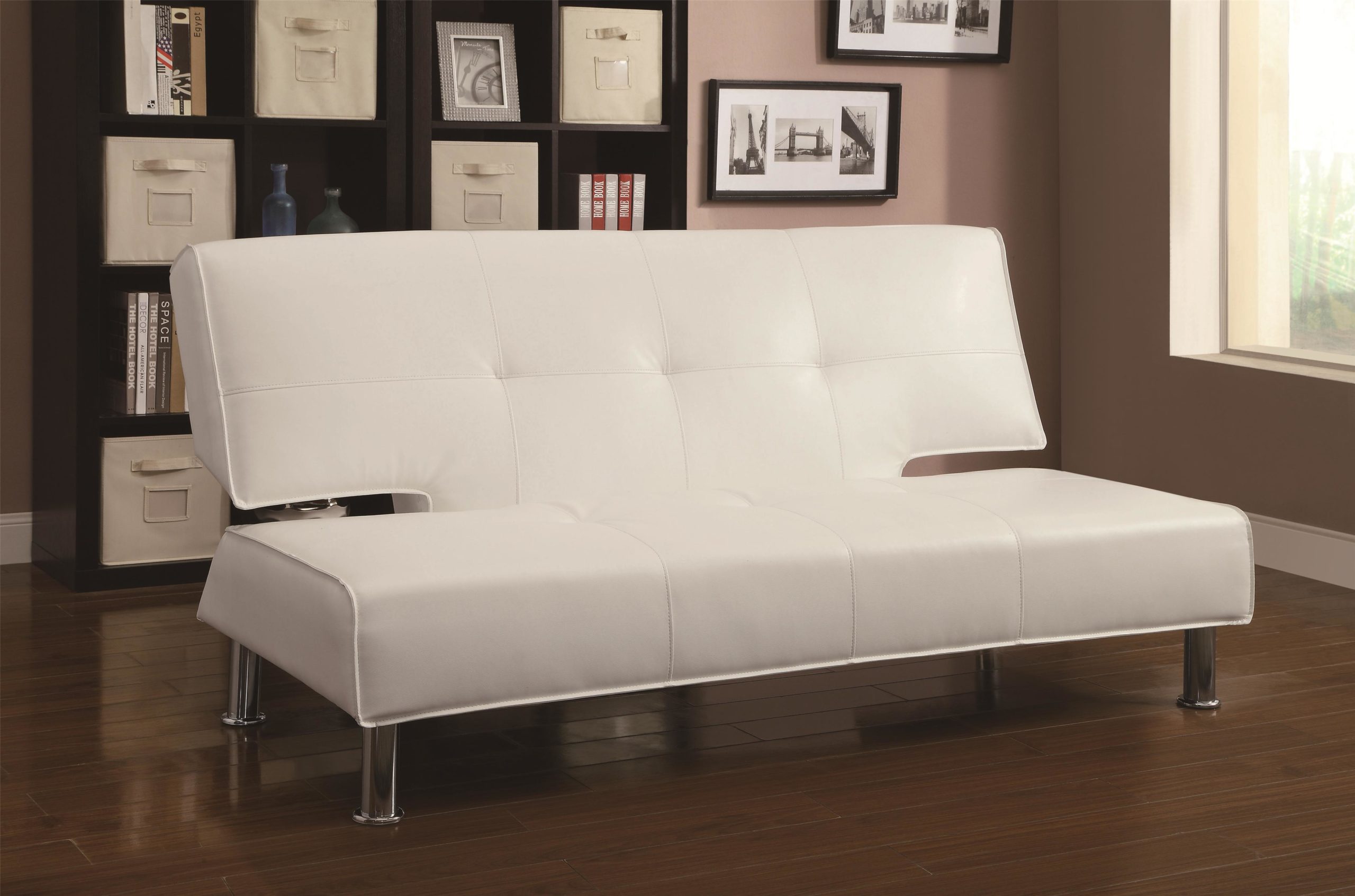 White Adjustable Armless Sofa Bed with chrome legs in up position. Covered in a silky smooth white leather-like vinyl, this contemporary sofa bed is the perfect place to lounge during the day and accommodate guests at night. The convertible sofa features clean lines, modern chrome legs, and a subtly shaped back for a pop of contemporary style. Tufted seating and welt cords complete the modern vibe. A sturdy wooden frame provides support and durability, while plush padding offers lasting sleep-worthy comfort. When flat, adjustable sofa is: 72″W x 48.5″D x 16″H Collection Description Make the most of your valuable space with a convenient and stylish sofa bed. Available in many styles and colors to complement your decor, these multi-functional pieces offer comfortable lounging space by day, and a cozy bed for overnight guests. Great for small homes, apartments, condos, and dorms, a convertible sofa is just what you need to take advantage of your space, without sacrificing style. Product Details Item & Dimensions Manufacturer Coaster Length (side to side) 72″ L Height (bottom to top) 35″ H Width (front to back) 38″ W Seat Depth 22″ Fabric & Upholstery Fabric Options Available in Upholstery Option/s Shown